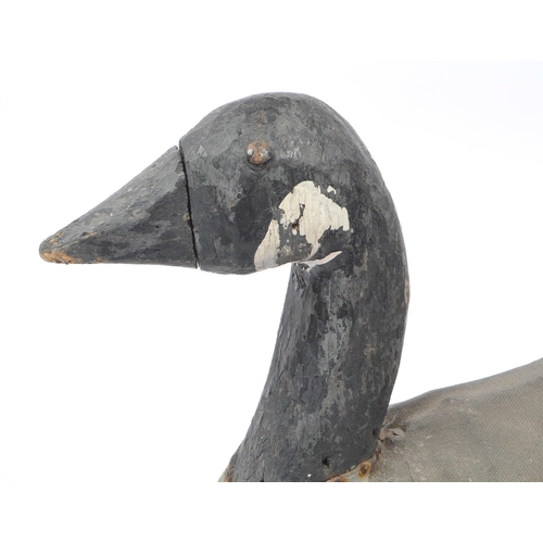 210 - An early 20th Century circa. 1920s carved wooden painted decoy duck with canvas coating to body. Mea... 