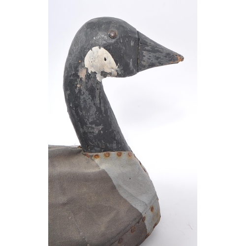 210 - An early 20th Century circa. 1920s carved wooden painted decoy duck with canvas coating to body. Mea... 