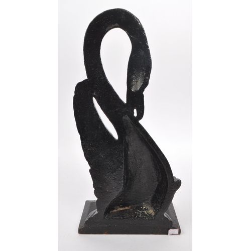 215 - A 20th Century cast iron painted door porter / door stop figure in the form of a swan with long curv... 