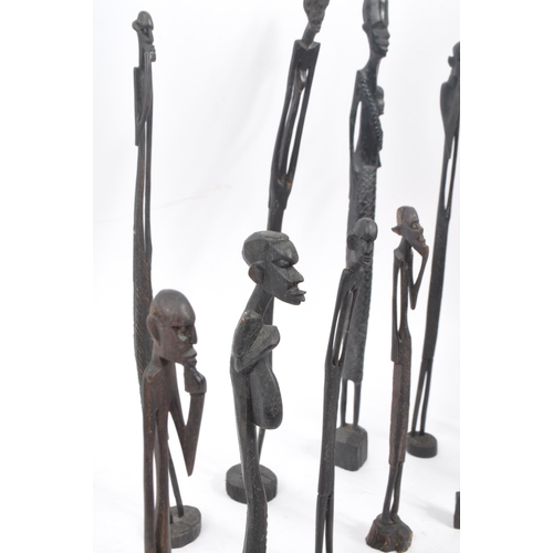 216 - A collection of 20th century East African wooden figure carvings. The figures each carved from eboni... 