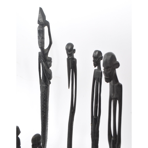 216 - A collection of 20th century East African wooden figure carvings. The figures each carved from eboni... 