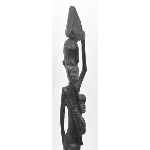 216 - A collection of 20th century East African wooden figure carvings. The figures each carved from eboni... 