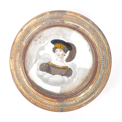 218 - A George III 18th century ladies patch box. Of circular form with worn gilt finish with portrait of ... 