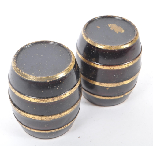 221 - A pair of early 19th century circa 1800 travel inkwell. In the form of barrels with ebonised ground ... 