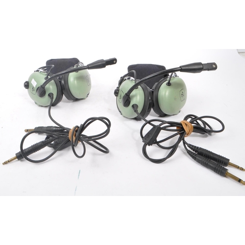 222 - Aviation Interest - David Clark - Two David Clark Company aviation headsets having light green ear p... 