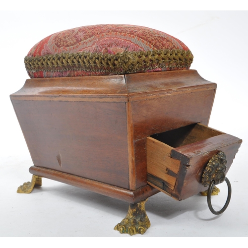 227 - A George III early 19th century mahogany sewing companion / pin cushion. Sarcophagus form with drop ... 