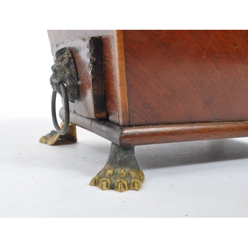 227 - A George III early 19th century mahogany sewing companion / pin cushion. Sarcophagus form with drop ... 