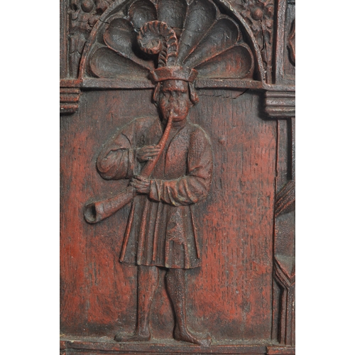 229 - A pair of 17th century style figural panels, oak effect resin moulds one depicting a courting couple... 