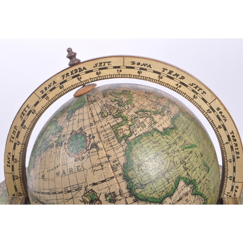 238 - A vintage 20th century desktop terrestrial world globe. The globe supported in a walnut wooden stand... 