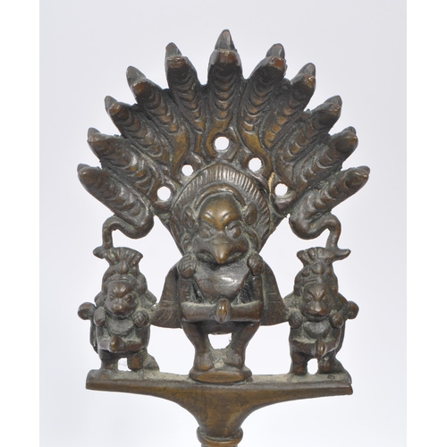 242 - An early 20th century North Indian brass Garuda Pooja prayer bell. The bell featuring a rounded bell... 