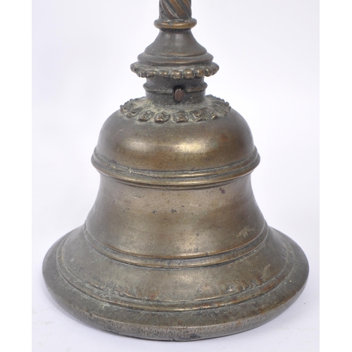 242 - An early 20th century North Indian brass Garuda Pooja prayer bell. The bell featuring a rounded bell... 