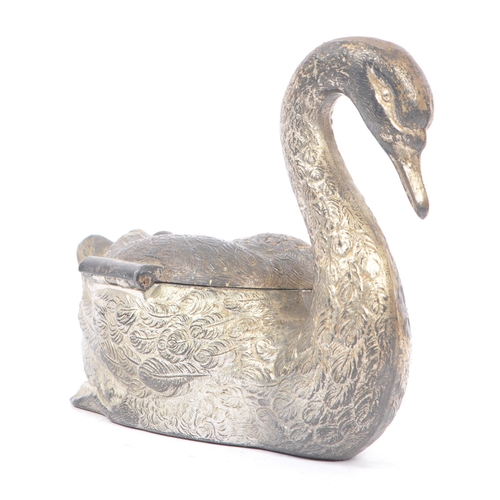 243 - An early 20th century silver plated swan jewellery casket. The box in the form of a swan, with relie... 