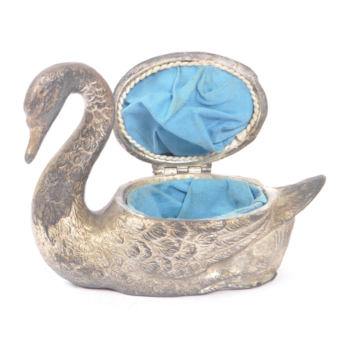 243 - An early 20th century silver plated swan jewellery casket. The box in the form of a swan, with relie... 