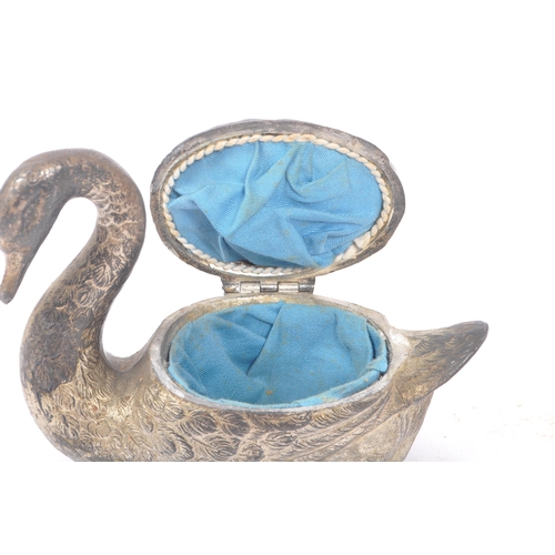 243 - An early 20th century silver plated swan jewellery casket. The box in the form of a swan, with relie... 