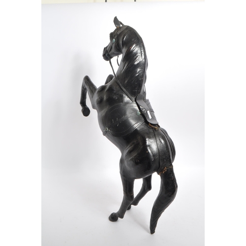 244 - Manner of Liberty - An early 20th century manner of Liberty leather rearing horse decoration figure.... 