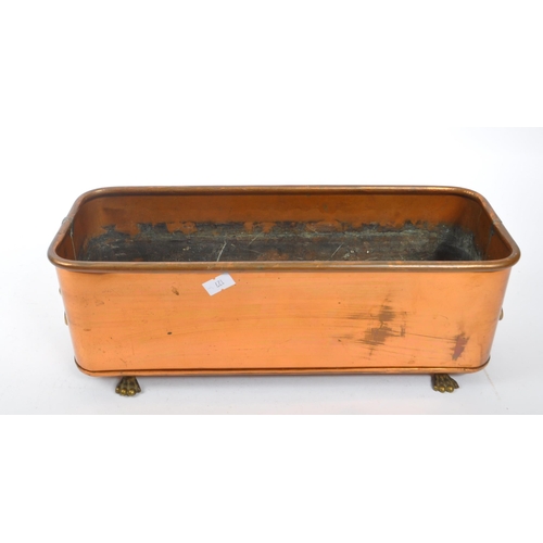 252 - A 19th century Victorian copper windowsill planter. The planter featuring lions head ring handles to... 