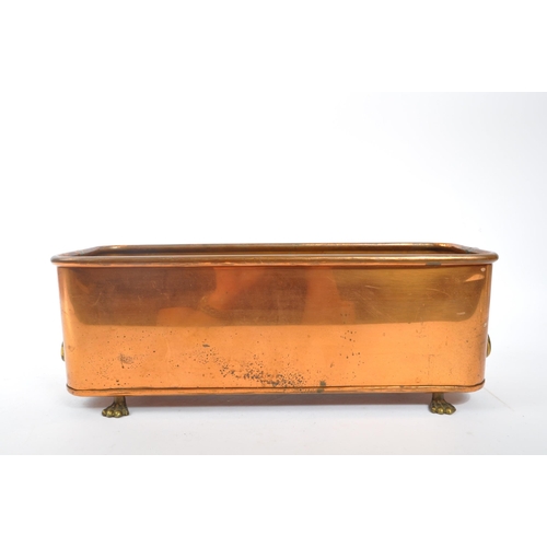 252 - A 19th century Victorian copper windowsill planter. The planter featuring lions head ring handles to... 