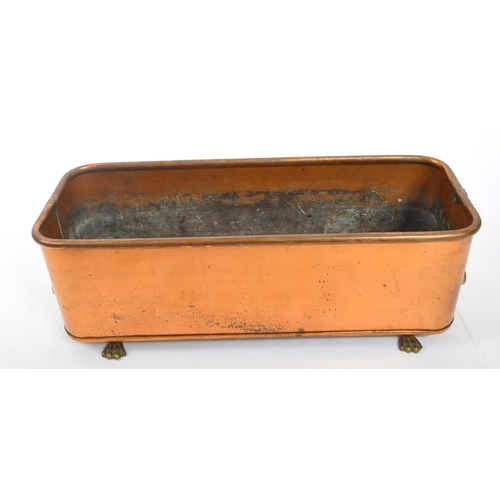 252 - A 19th century Victorian copper windowsill planter. The planter featuring lions head ring handles to... 