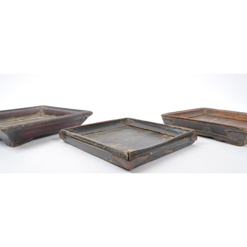 261 - Three 19th century Chinese wooden plant stands. The stands each of square form, with two raised on s... 