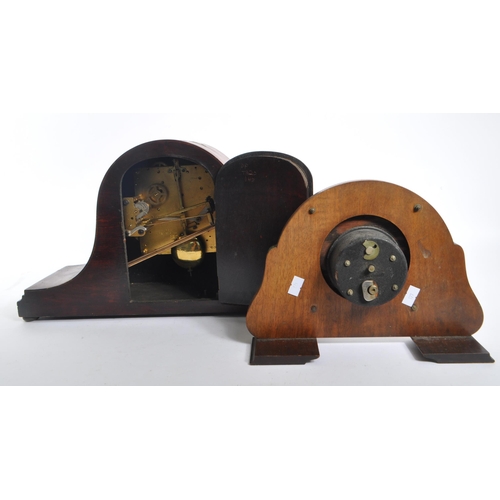 262 - Two early 20th century British ' Japanned ' mantel clocks. The larger of the two clocks having a tam... 