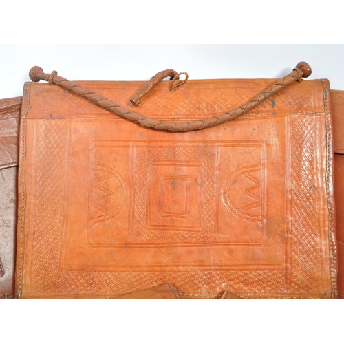 264 - A collection of vintage leather document / folio cases carriers to include tooled example with brass... 