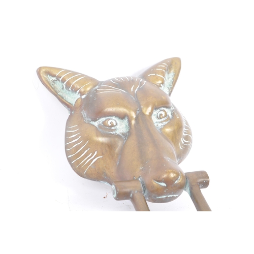 268 - A large brass 20th Century vintage brass door knocker in the form of a fox head with swing handle. M... 