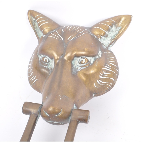 268 - A large brass 20th Century vintage brass door knocker in the form of a fox head with swing handle. M... 