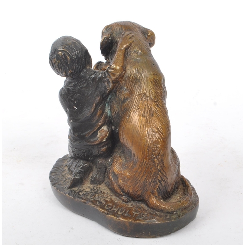 269 - Schultz - A bronze figure in the form of a boy feeding dog upon base signed ' Schultz '. The dog in ... 