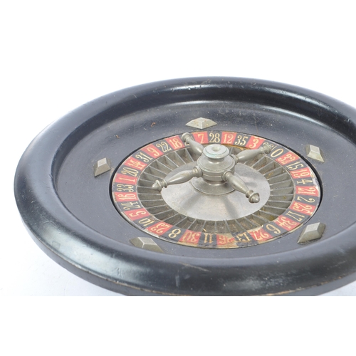 272 - An early 20th Century French roulette wheel signed JAL 24 and engraved 4611 to base. Measuring appro... 