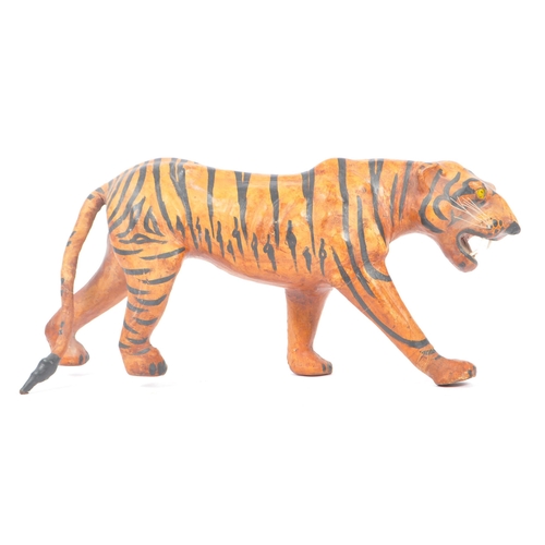 273 - A 20th Century circa. 1960s painted faux leather papier mache French tiger figure. The figure being ... 