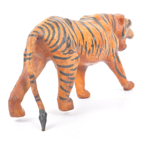 273 - A 20th Century circa. 1960s painted faux leather papier mache French tiger figure. The figure being ... 