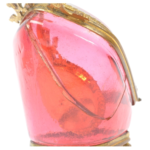 274 - A 19th Century Victorian cranberry glass and gilt metal pocket watch holder / display case upon four... 