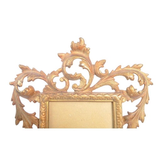 276 - A pair of 19th Century brass gilded rococo style picture frames of rectangular form having ornate ac... 