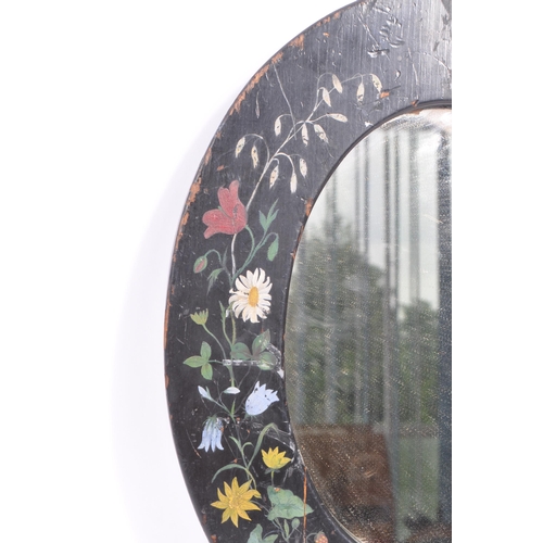 278 - An early 20th Century toleware hand painted folk art style wooden oval mirror having painted black g... 