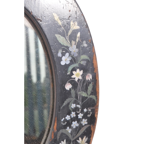 278 - An early 20th Century toleware hand painted folk art style wooden oval mirror having painted black g... 