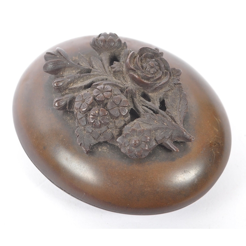 281 - A 19th Century Victorian Vulcanite lidded oval pot having intricate carved floral bouquet to the top... 