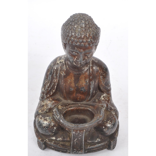 285 - A 19th Century filled Buddha figure in seated lotus pose position with legs crossed and arms to the ... 