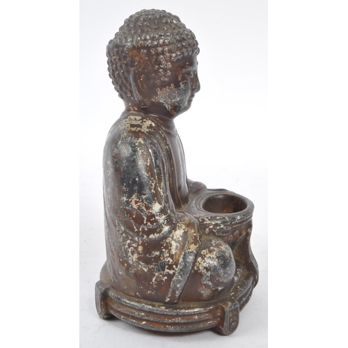 285 - A 19th Century filled Buddha figure in seated lotus pose position with legs crossed and arms to the ... 