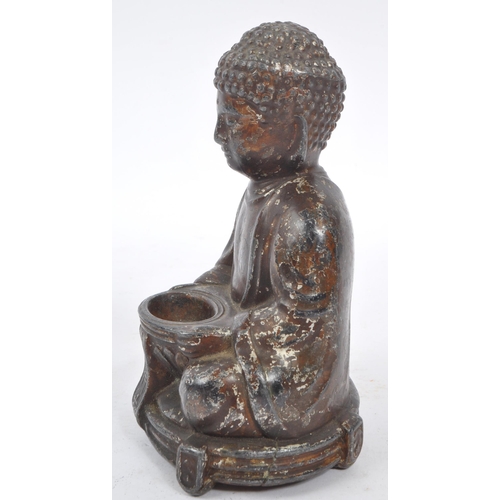 285 - A 19th Century filled Buddha figure in seated lotus pose position with legs crossed and arms to the ... 