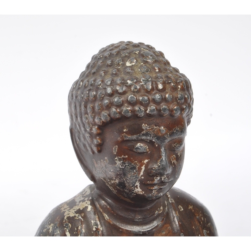 285 - A 19th Century filled Buddha figure in seated lotus pose position with legs crossed and arms to the ... 