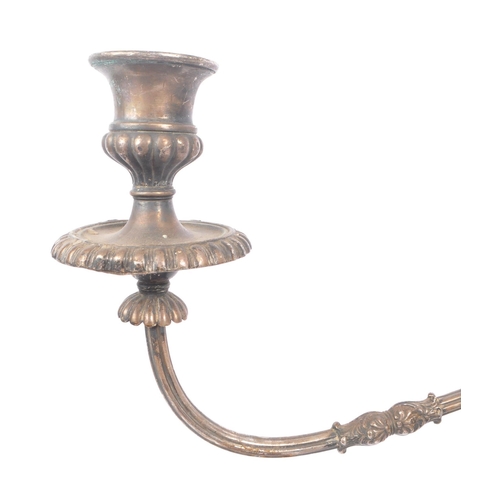 288 - An early 20th Century large silver plated twisted twin arm candelabra having scalloped edge detailin... 