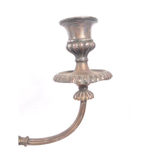 288 - An early 20th Century large silver plated twisted twin arm candelabra having scalloped edge detailin... 