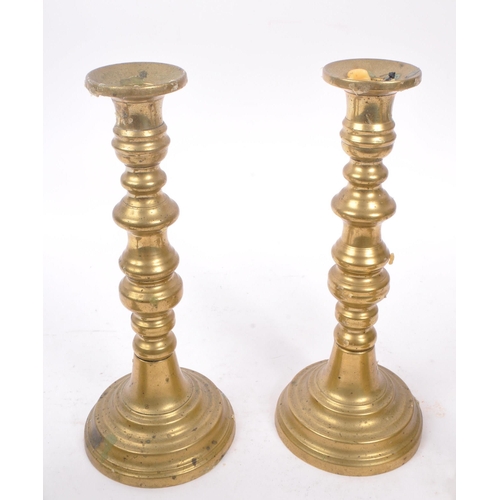 291 - Two pairs of19th Century Victorian brass candlesticks to include a pair of ' Queen of Diamonds ' bot... 