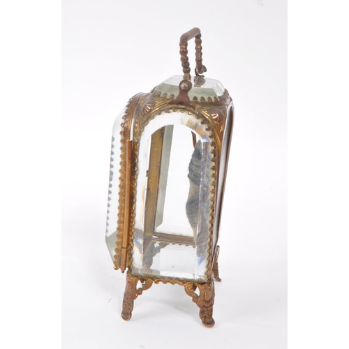 296 - An early 20th Century French glass and gilt metal miniature jewellery / pocket watch holder / vitrin... 