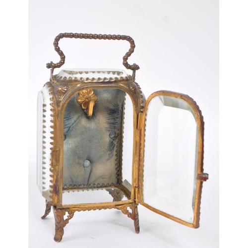 296 - An early 20th Century French glass and gilt metal miniature jewellery / pocket watch holder / vitrin... 