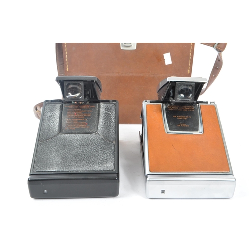 299 - Polaroid - Two 20th century circa 1970s Polaroid SX-70 SLR instant land cameras. Each camera having ... 