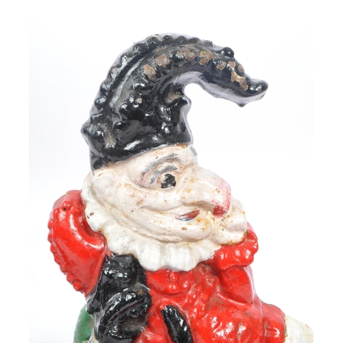 306 - Punch & Judy - A set of cast iron Punch and Judy doorstops. The figurative doorstops depicting Punch... 