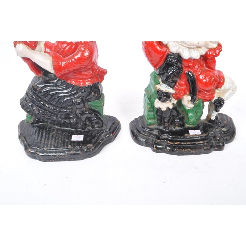 306 - Punch & Judy - A set of cast iron Punch and Judy doorstops. The figurative doorstops depicting Punch... 