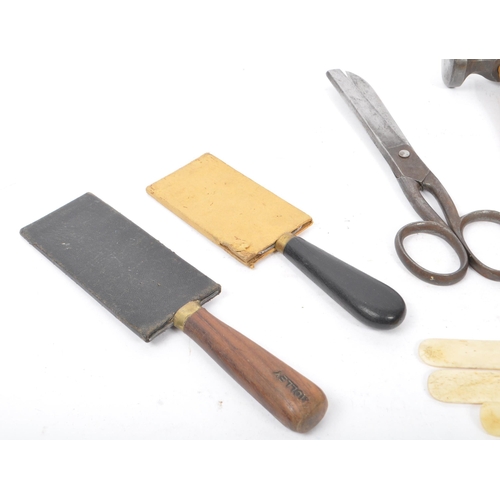 310 - A collection of mid Century and later vintage leather making tools to include scissors, leather cutt... 