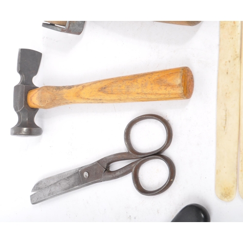 310 - A collection of mid Century and later vintage leather making tools to include scissors, leather cutt... 